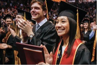 Students clapping during commencement ceremony