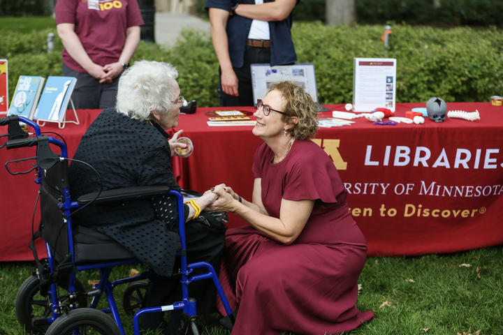 President Cunningham visits with a University community member at the community celebration.