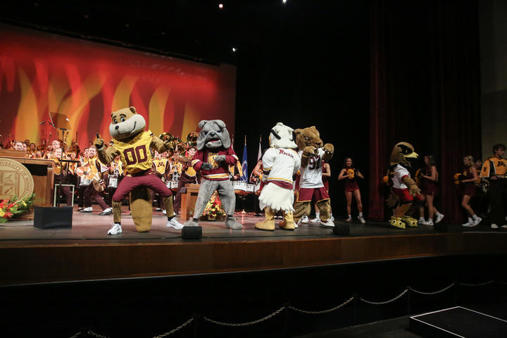 Mascots from the University of Minnesota System dance and celebrate at the inauguration ceremony.