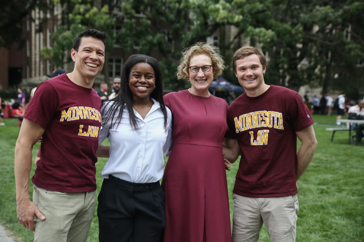 President Cunningham poses with members of the University community at the community celebration.